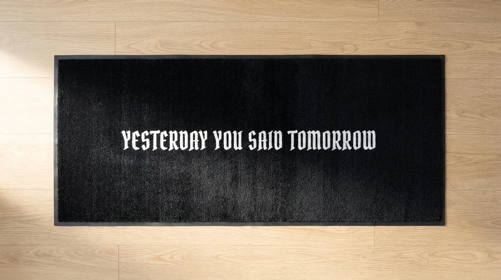 Black custom text mat: Yesterday you said tomorrow