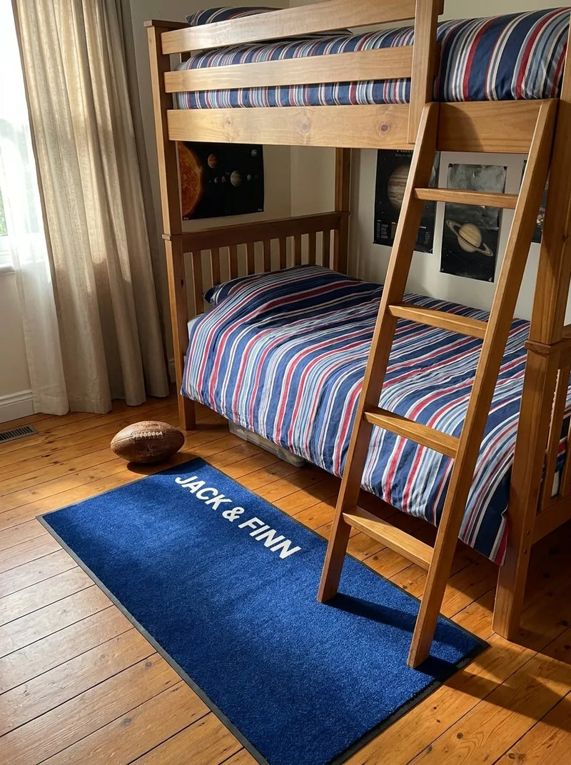 Pink name mat in a girl's room